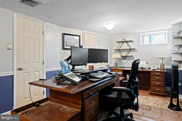 office with light hardwood / wood-style flooring