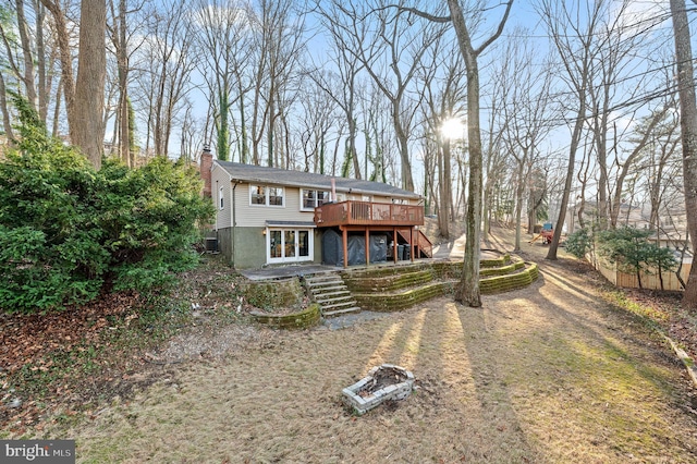 view of front of property with a wooden deck