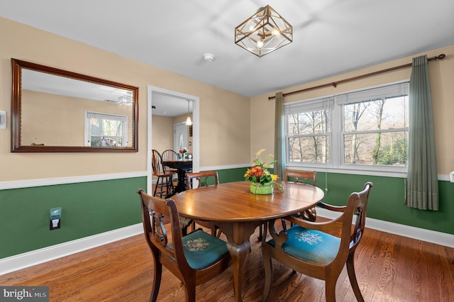 dining space featuring hardwood / wood-style flooring