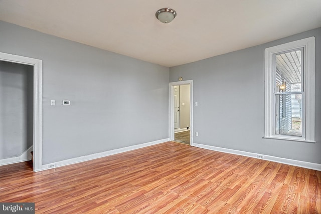 spare room featuring light wood-type flooring