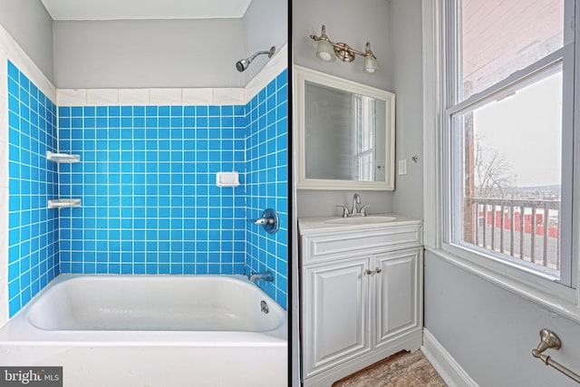 bathroom featuring vanity and shower / bath combination