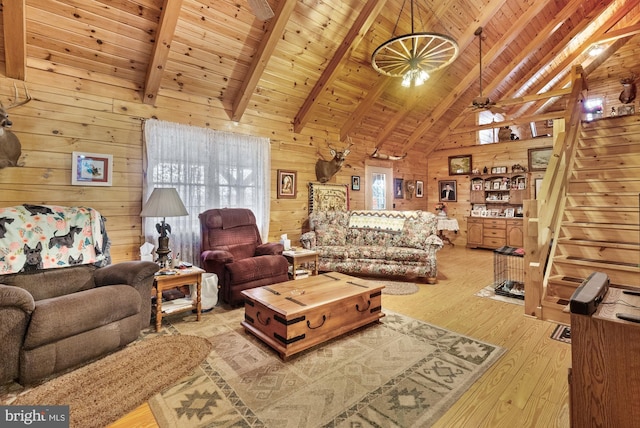 living room with beam ceiling, wooden ceiling, light hardwood / wood-style flooring, and wooden walls