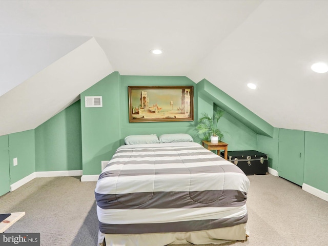 carpeted bedroom featuring vaulted ceiling