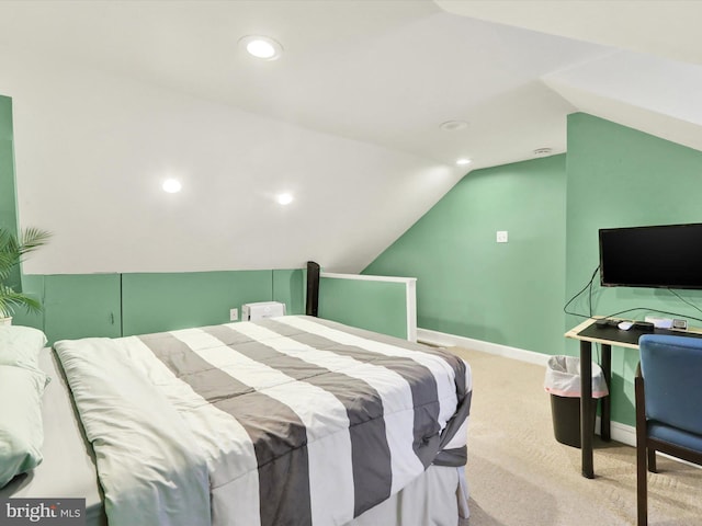 bedroom with light colored carpet and vaulted ceiling