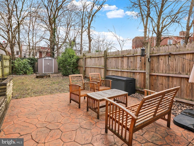 view of patio with a storage shed