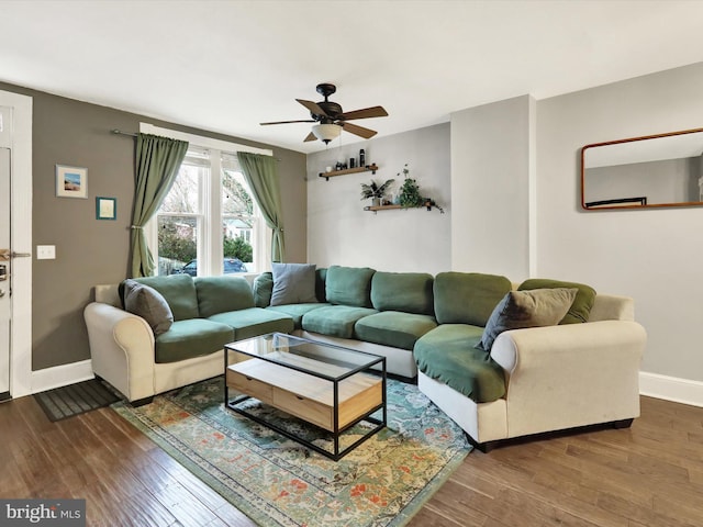 living room featuring ceiling fan and wood-type flooring