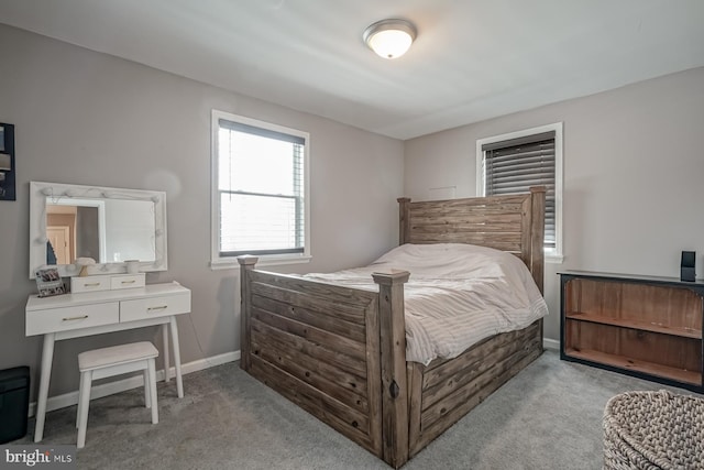 bedroom with light colored carpet