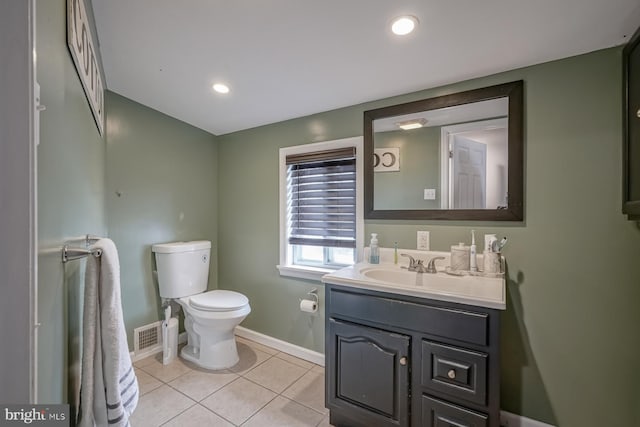 bathroom with tile patterned floors, vanity, and toilet