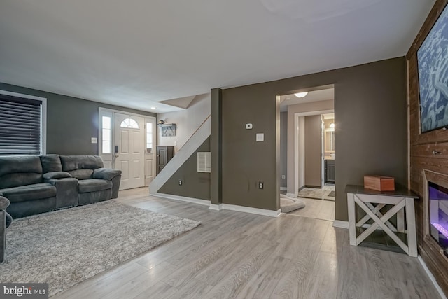 living room with light hardwood / wood-style flooring