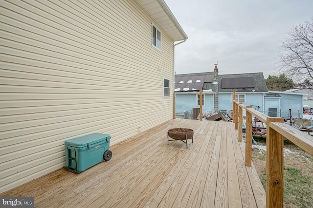 deck with an outdoor fire pit