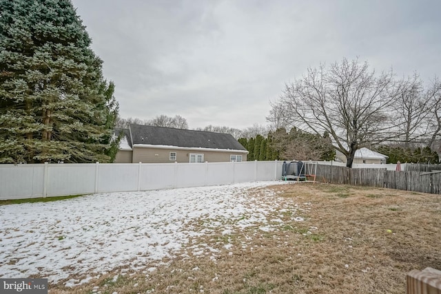 view of yard with a trampoline