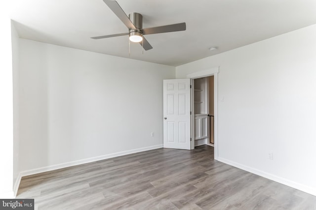 unfurnished room with ceiling fan and light hardwood / wood-style floors