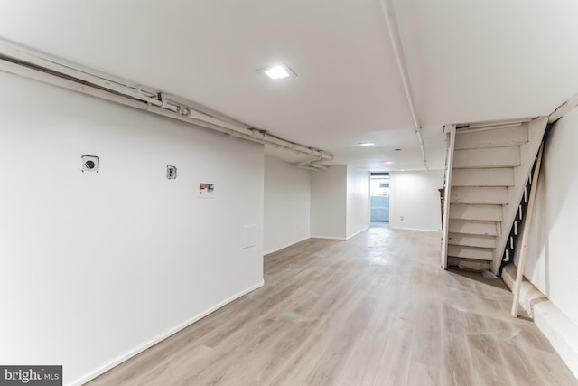 basement featuring light hardwood / wood-style floors