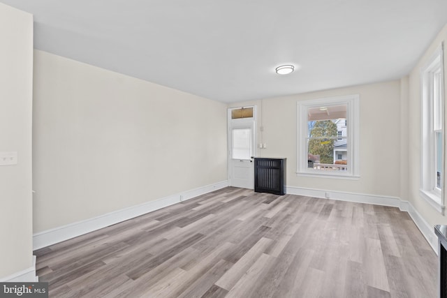 unfurnished living room with light hardwood / wood-style floors