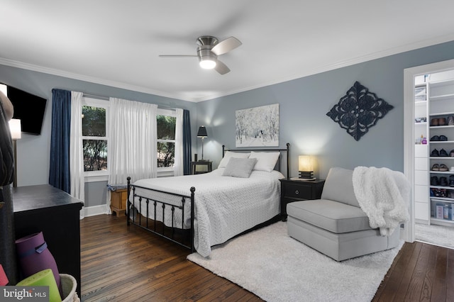 bedroom with ceiling fan, crown molding, and dark hardwood / wood-style floors