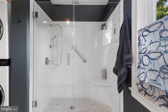 bathroom with a shower with shower door