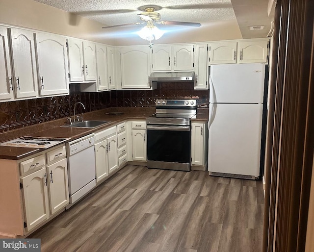 kitchen featuring ceiling fan, sink, backsplash, white appliances, and white cabinets