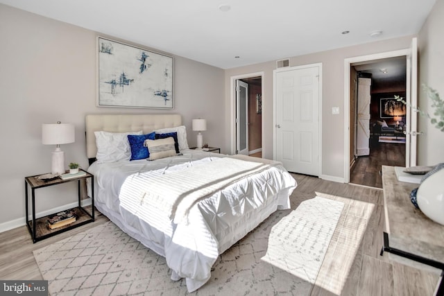 bedroom with light wood-type flooring