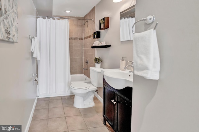 full bathroom featuring tile patterned floors, vanity, shower / bath combination with curtain, and toilet