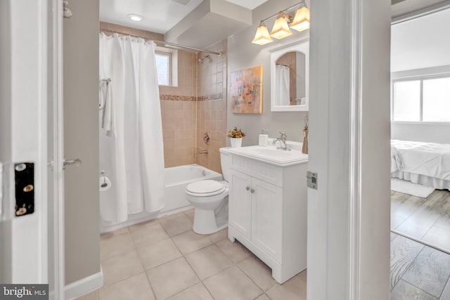 full bathroom with tile patterned flooring, vanity, shower / bath combination with curtain, and toilet