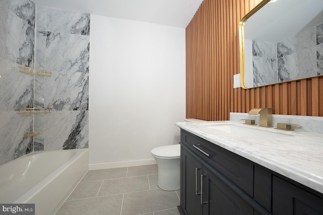 bathroom featuring tile patterned floors, vanity, and toilet