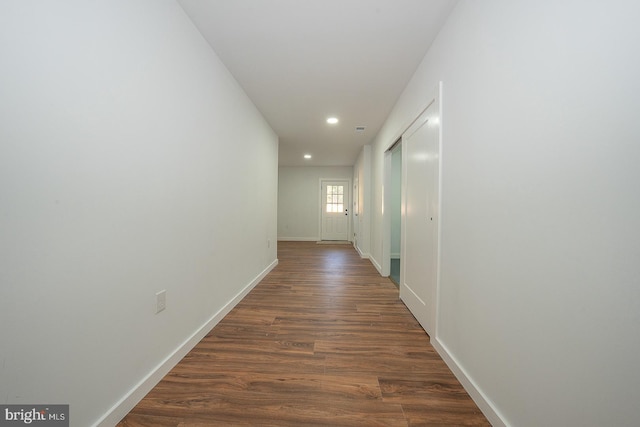 hallway featuring dark hardwood / wood-style flooring