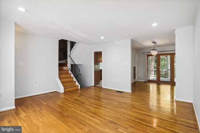 spare room featuring hardwood / wood-style flooring