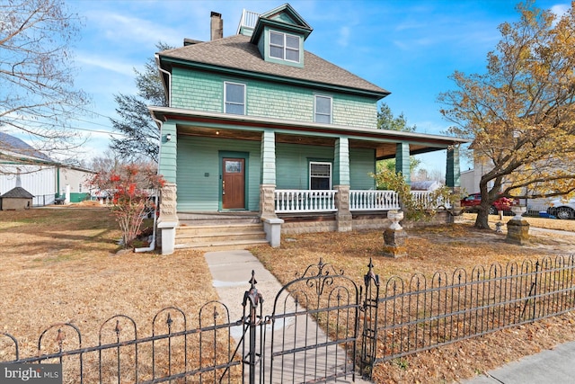 view of front facade featuring a fenced front yard, a porch, roof with shingles, a chimney, and a gate