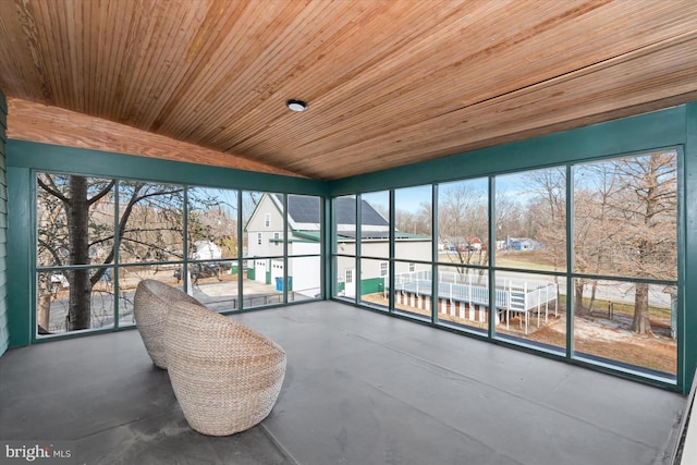 unfurnished sunroom with wooden ceiling and vaulted ceiling