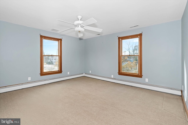 spare room with ceiling fan and light colored carpet