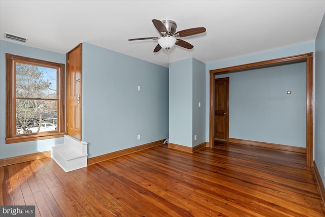 interior space with dark hardwood / wood-style floors and ceiling fan