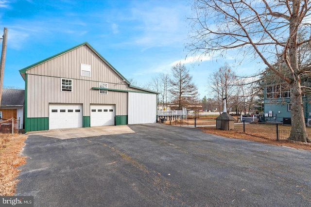 view of side of home featuring a garage