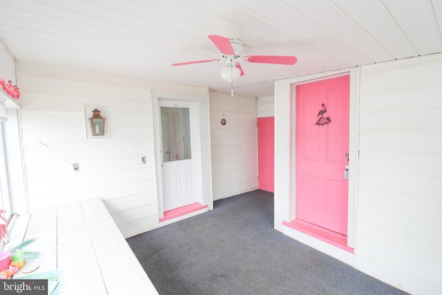 doorway to property with ceiling fan