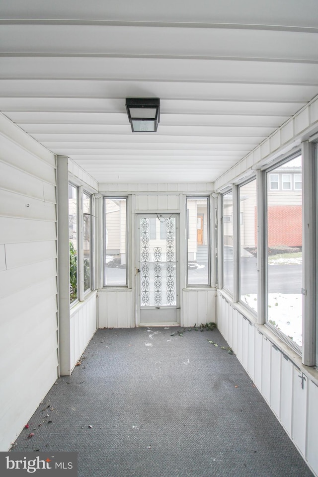 unfurnished sunroom with plenty of natural light