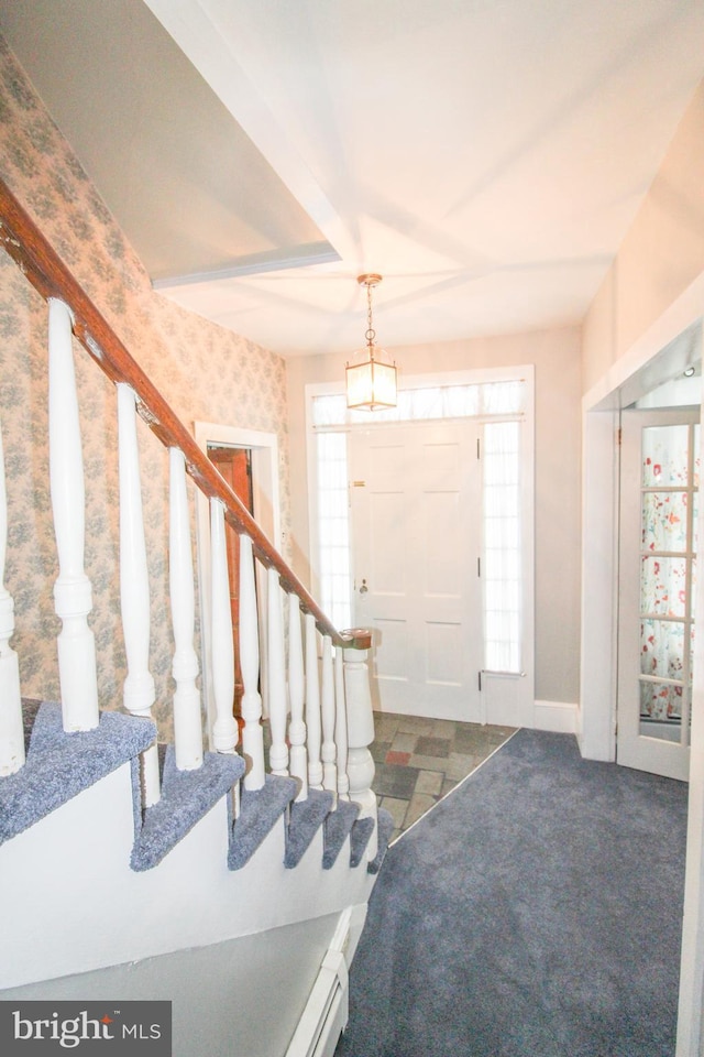 view of carpeted entrance foyer