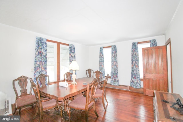 dining space with hardwood / wood-style floors