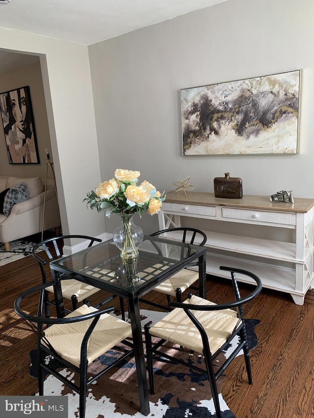 dining room with dark wood-type flooring