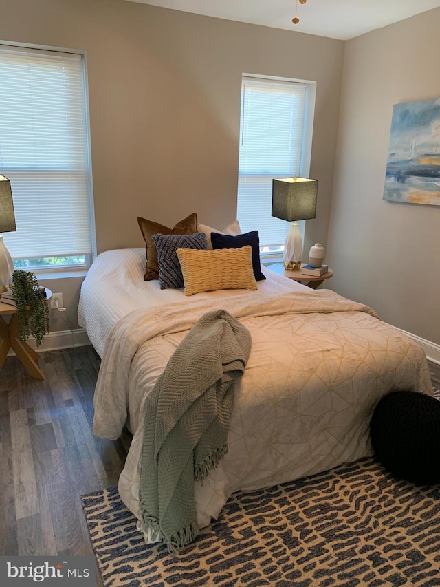 bedroom featuring dark hardwood / wood-style flooring