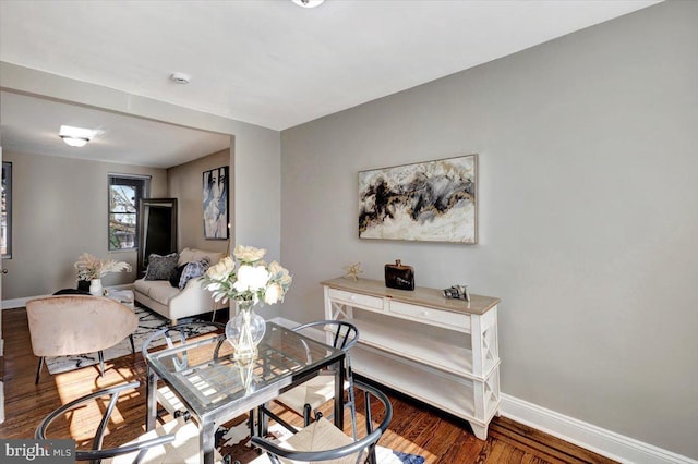 living room with dark hardwood / wood-style flooring