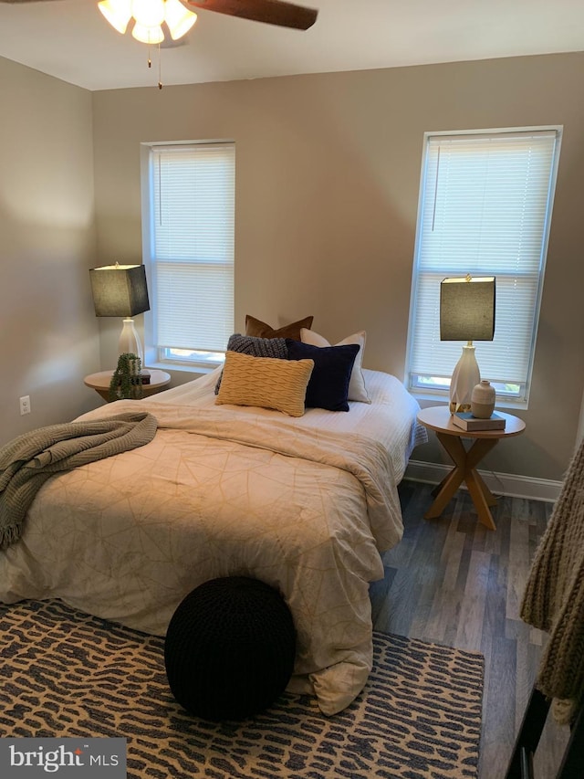 bedroom featuring ceiling fan and dark wood-type flooring