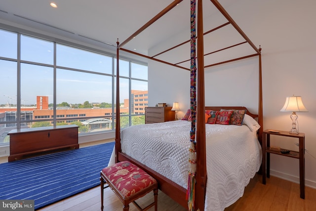 bedroom with hardwood / wood-style floors