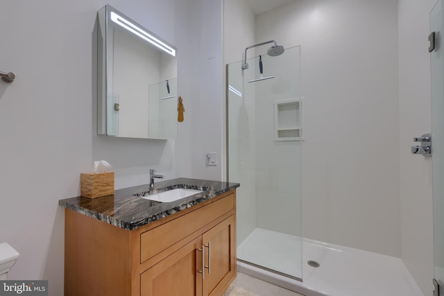 bathroom with vanity and an enclosed shower