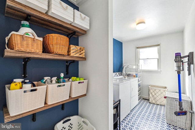 laundry area with independent washer and dryer