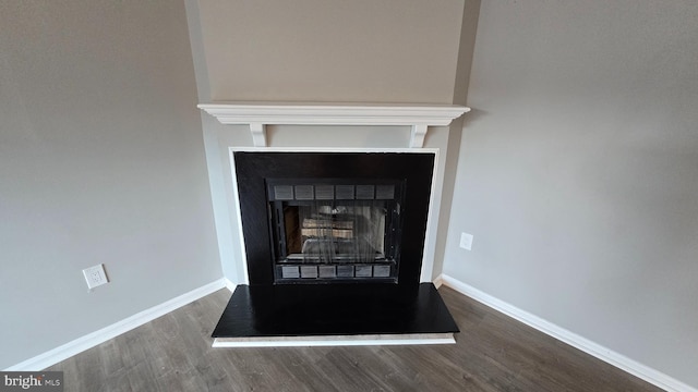 interior details featuring hardwood / wood-style flooring