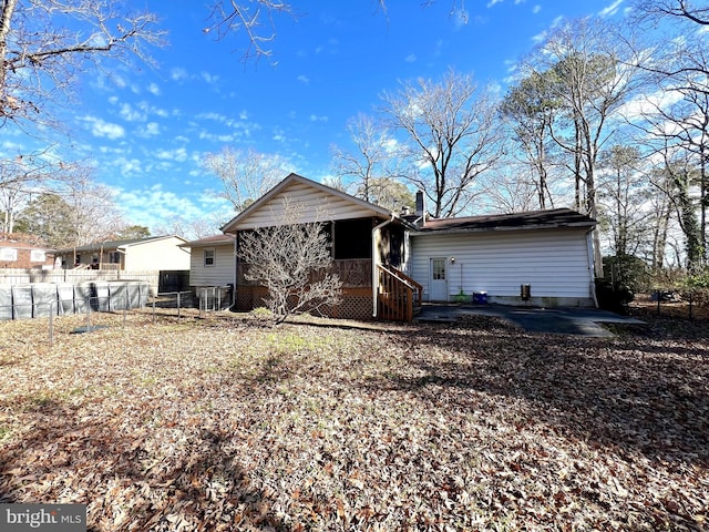 rear view of property featuring a patio area