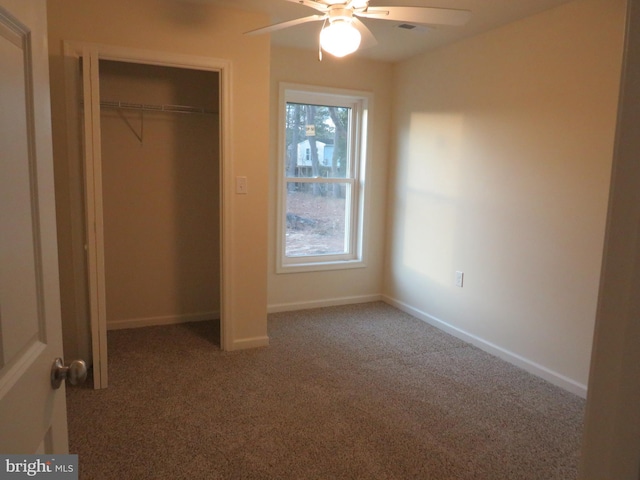 unfurnished bedroom with carpet, multiple windows, a closet, and ceiling fan