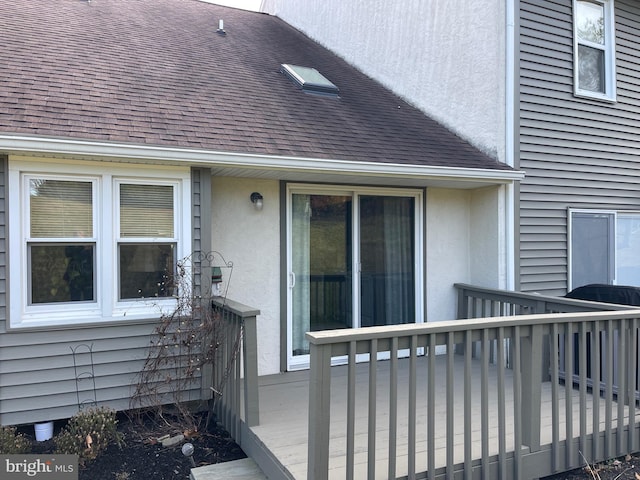 view of side of property featuring a deck