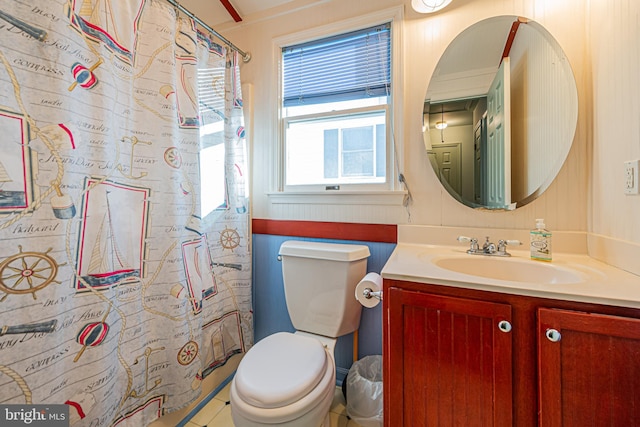 bathroom with vanity, a shower with shower curtain, and toilet