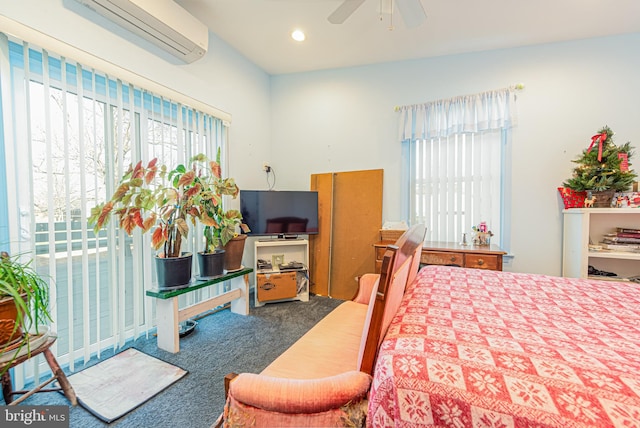 carpeted bedroom with ceiling fan and a wall mounted AC