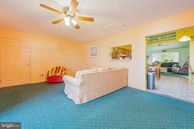 living room featuring ceiling fan and carpet